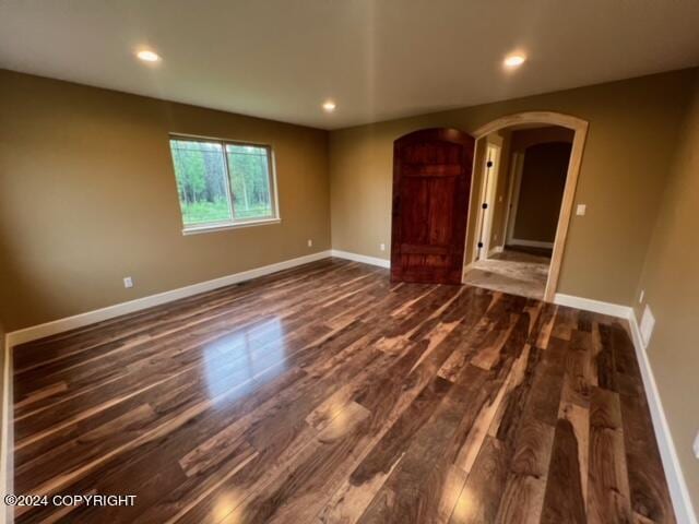 spare room with hardwood / wood-style floors