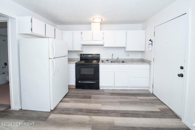 kitchen featuring white cabinetry, white refrigerator, light hardwood / wood-style floors, sink, and black electric range