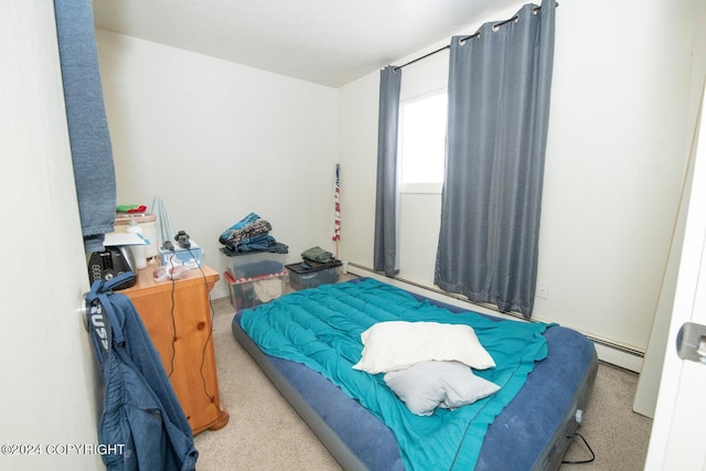 bedroom featuring a baseboard radiator and light colored carpet