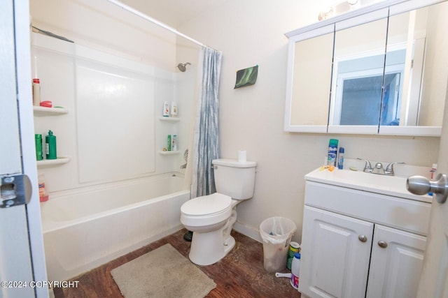 full bathroom featuring hardwood / wood-style floors, shower / bathtub combination with curtain, vanity, and toilet