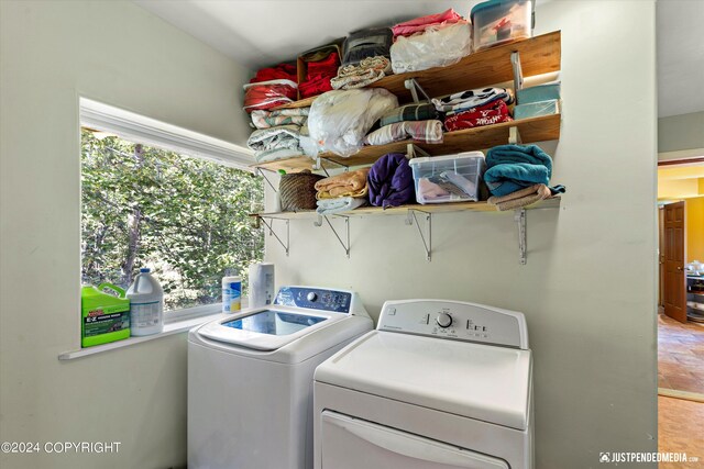 washroom with independent washer and dryer