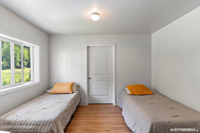 bedroom with light wood-type flooring