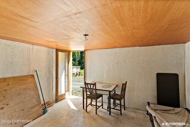 dining space with wood ceiling