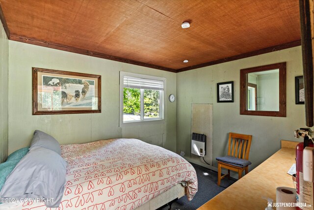 carpeted bedroom featuring heating unit and wooden ceiling