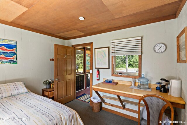 carpeted bedroom with wood ceiling