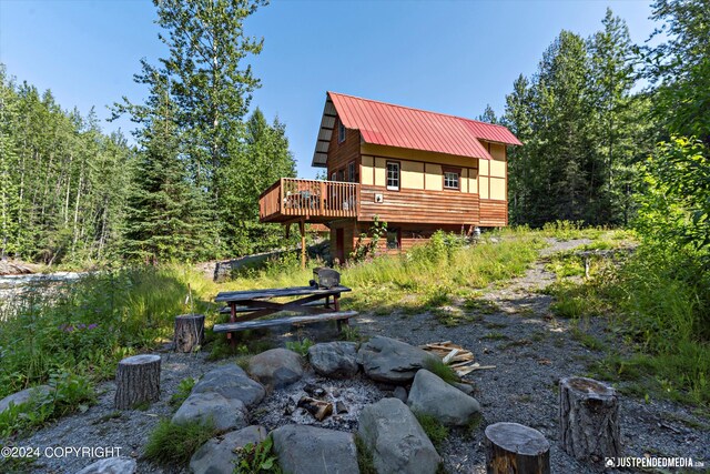 rear view of property with a deck