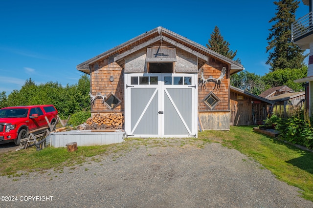 view of outdoor structure with a yard