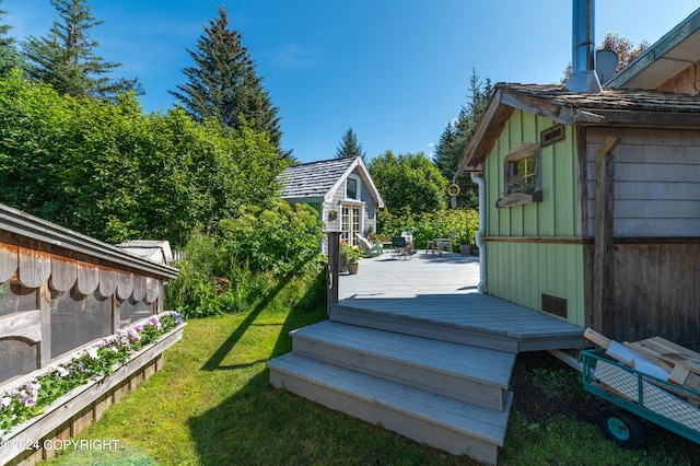 view of yard with an outbuilding and a deck