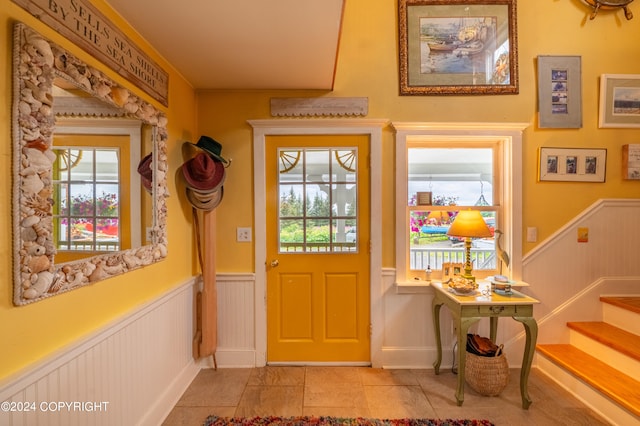 entryway featuring light tile patterned floors