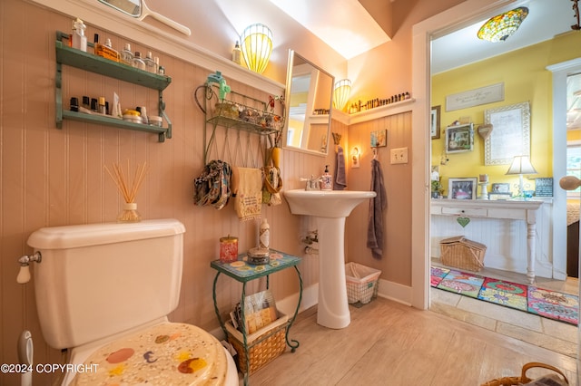 bathroom featuring toilet and hardwood / wood-style floors