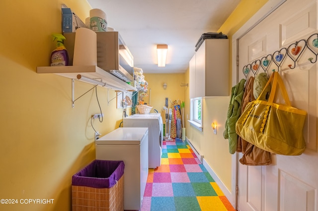 clothes washing area featuring washing machine and dryer and light tile patterned floors