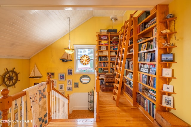 interior space featuring vaulted ceiling, light hardwood / wood-style floors, and wood ceiling