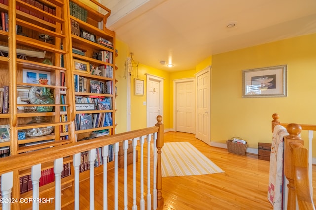 hallway with light hardwood / wood-style flooring