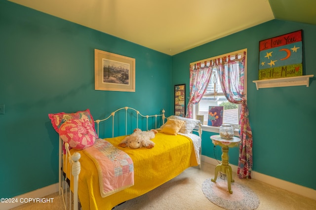 carpeted bedroom featuring vaulted ceiling