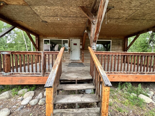 doorway to property with a wooden deck