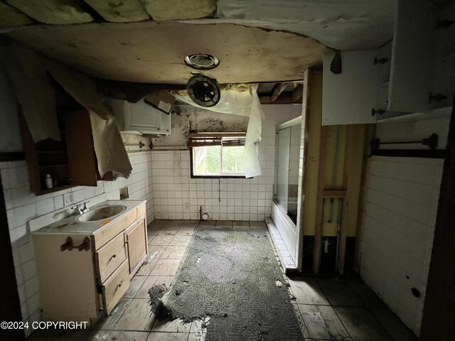 kitchen with light countertops and a sink