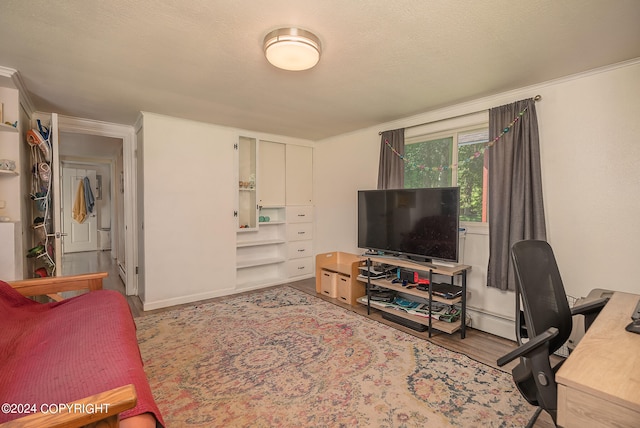 living room with light hardwood / wood-style floors and crown molding