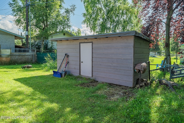 view of outdoor structure with a yard