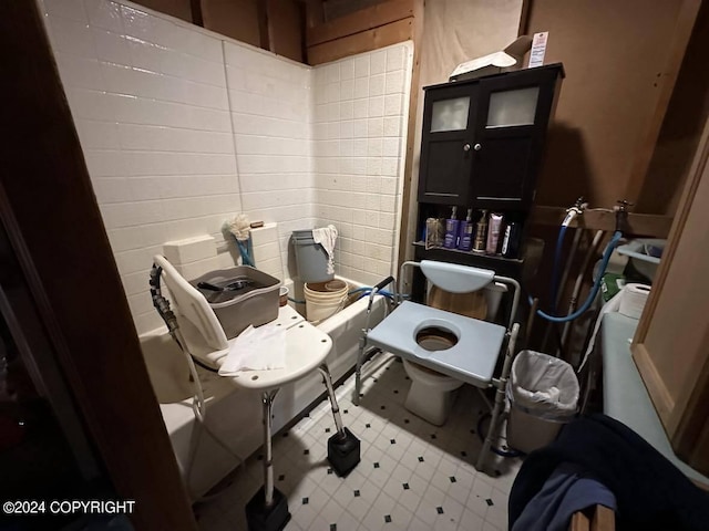 interior space with toilet and tile patterned floors