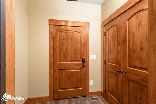 entrance foyer with dark hardwood / wood-style flooring