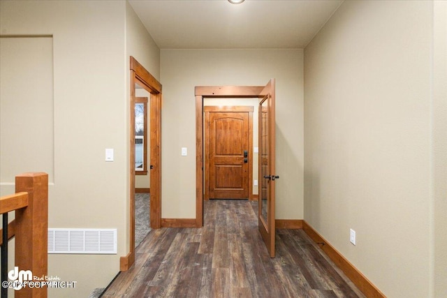 hallway with dark wood-type flooring