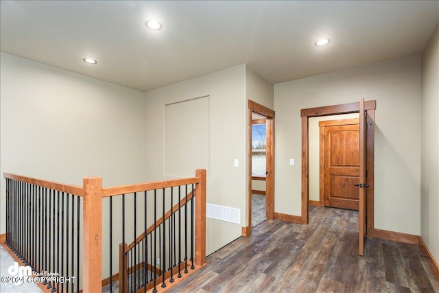 corridor featuring dark hardwood / wood-style flooring