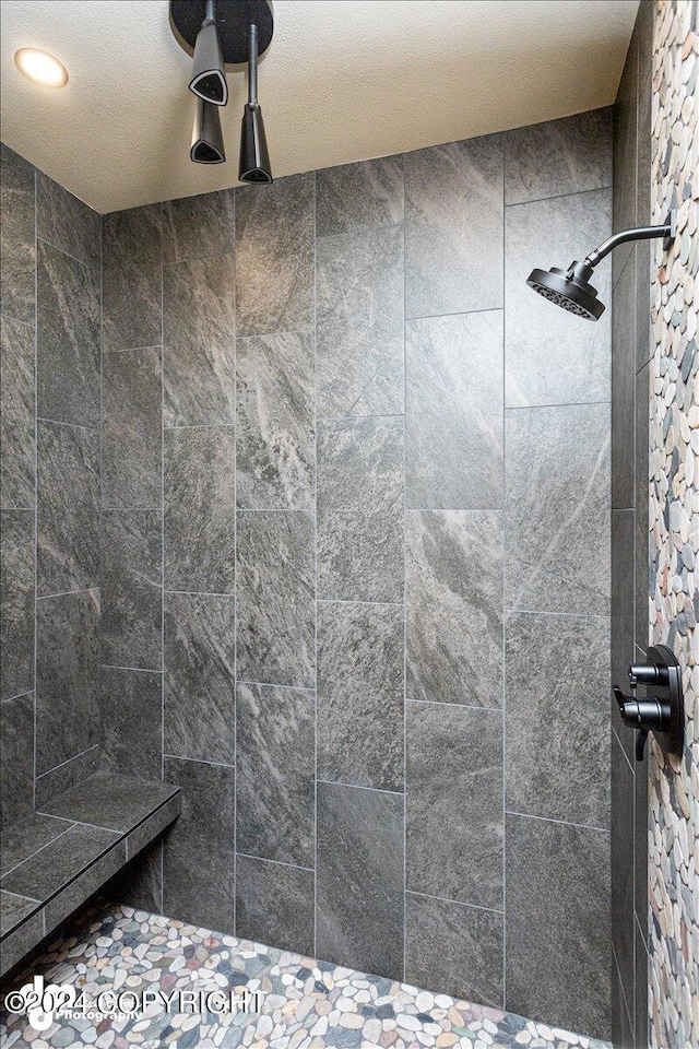 bathroom with tiled shower