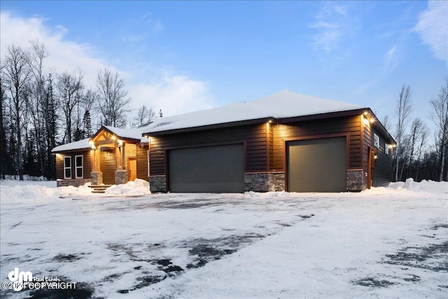 view of snow covered garage