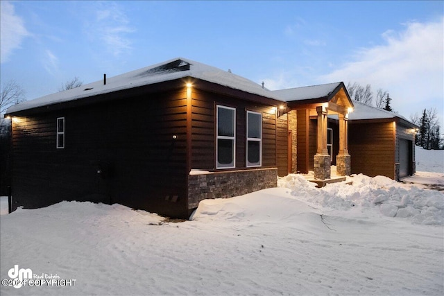 view of snow covered property