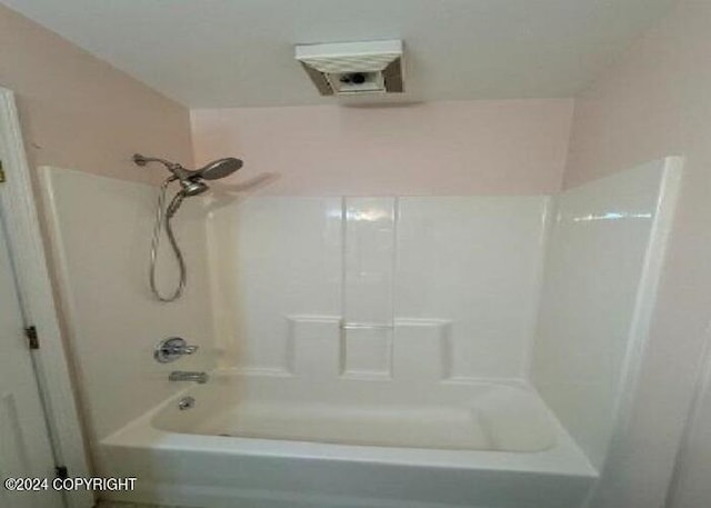 bathroom with shower / tub combination