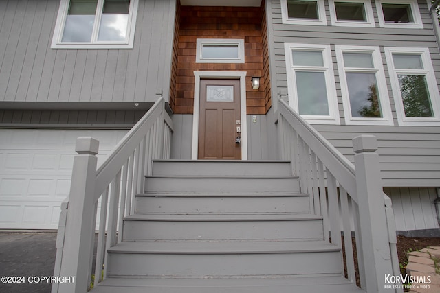 view of exterior entry featuring a garage