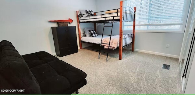 bedroom featuring light carpet