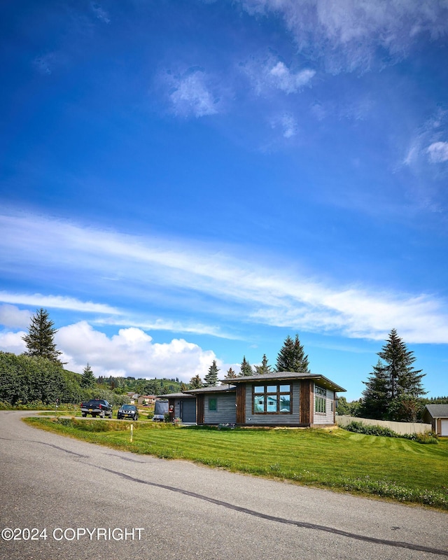 ranch-style house with a front lawn