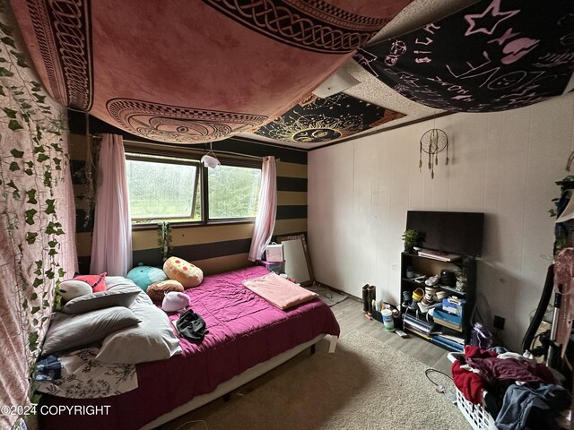 bedroom with hardwood / wood-style flooring