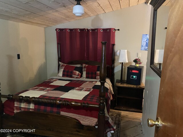 bedroom featuring tile patterned floors and wooden ceiling