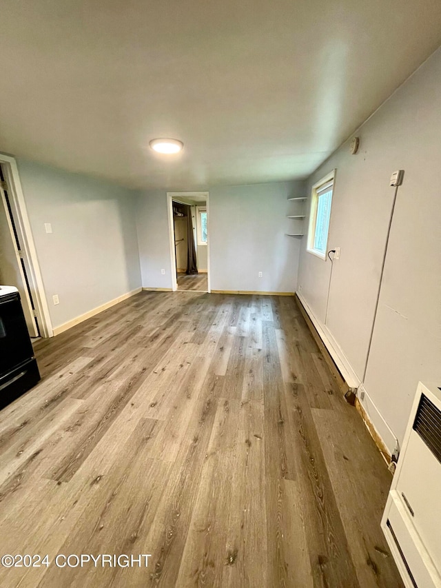 unfurnished living room with hardwood / wood-style flooring