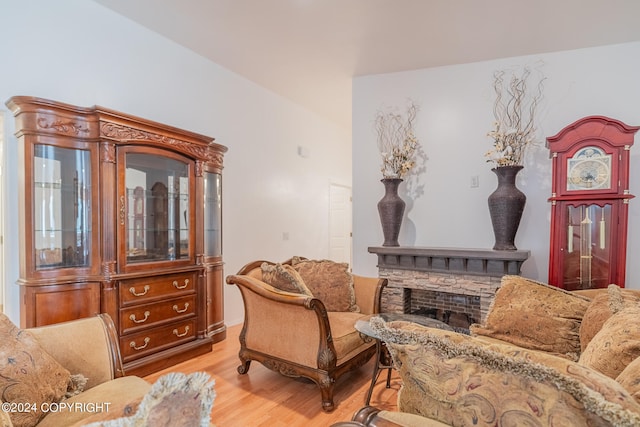 sitting room featuring a fireplace and light wood-type flooring