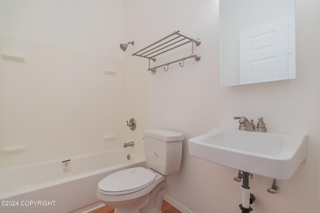 bathroom with shower / washtub combination and toilet