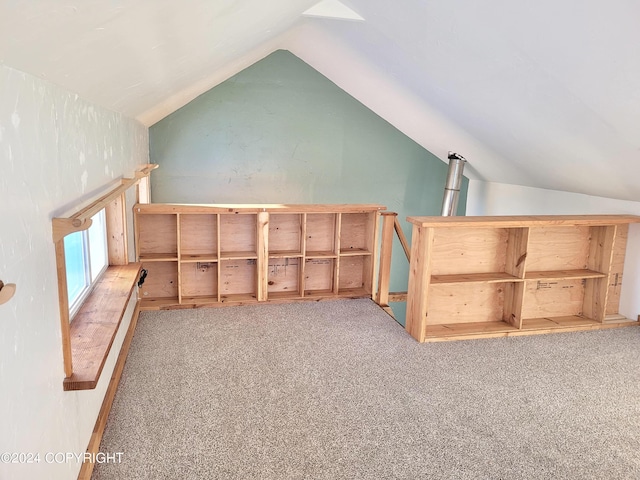 bonus room featuring light carpet and lofted ceiling