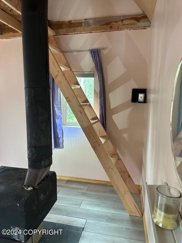 staircase featuring hardwood / wood-style floors