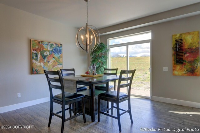 dining room with an inviting chandelier and wood-type flooring