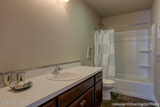 full bathroom featuring tile patterned flooring, shower / tub combo with curtain, toilet, and vanity