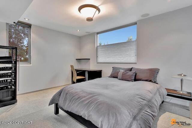 carpeted bedroom with baseboards