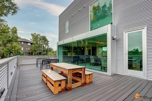 wooden deck featuring outdoor dining space