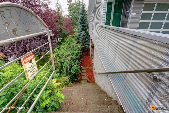 view of home's exterior with a balcony