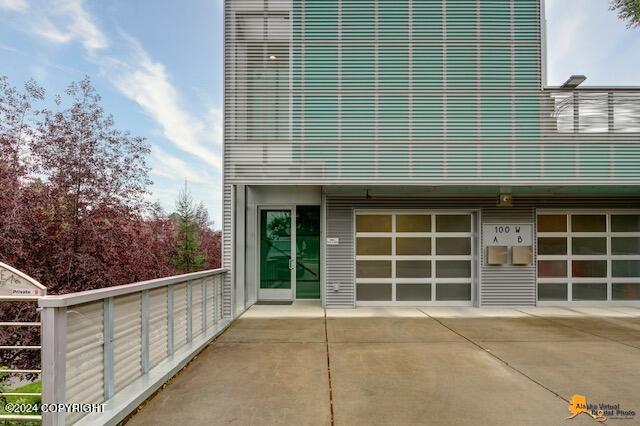 exterior space featuring concrete driveway