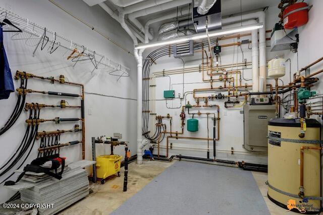 utility room featuring water heater