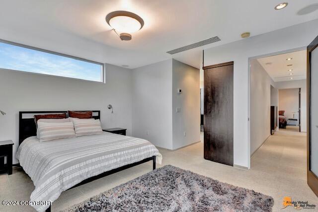 bedroom featuring visible vents and recessed lighting