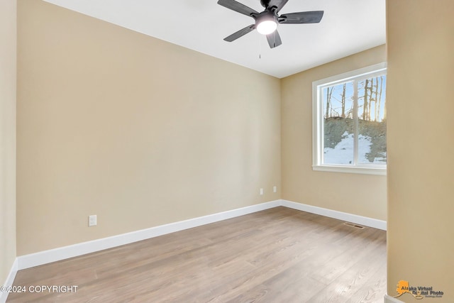 empty room with light hardwood / wood-style flooring and ceiling fan