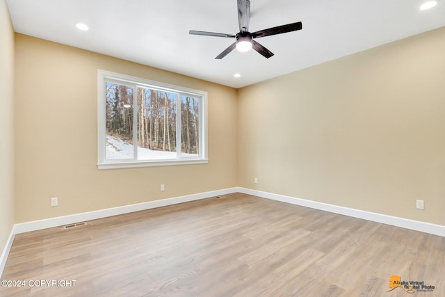 empty room featuring ceiling fan and light wood-type flooring